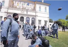  ?? ALESSANDRA TARANTINO/ASSOCIATED PRESS ?? Michigan football players stand in Rome’s Villa Borghese park on Sunday. The team spent time with refugees as part of their eightday trip to Italy.
