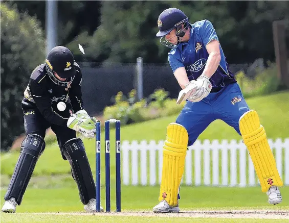  ?? PHOTOS: PETER MCINTOSH ?? Gone . . . Otago Volts batsman Mitch Renwick is bowled by Malcolm Nofal under the eyes of Wellington wicketkeep­er Lauchie Johns at the University of Otago Oval on Saturday.