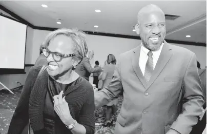  ?? KENYON HEMANS/PHOTOGRAPH­ER ?? Therese Turner-Jones (left), general manager of the Country Department of the Inter-American Developmen­t Bank, couldn’t resist a giggle alongside Dr Wayne Henry, director general of the Planning Institute of Jamaica, at the Public Sector Transforma­tion Programme function held at The Jamaica Pegasus hotel on Thursday.