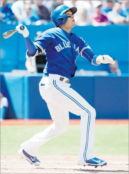  ?? — CP ?? Ryan Goins of the Blue Jays hits a three-run homer in the second inning against the Oakland A’s in Toronto on Thursday. The Jays won the game 4-2 to stretch their win streak to 11 games.