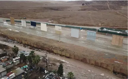  ?? (Xu Rui/Xinhua/Sipa USA/TNS) ?? THE EIGHT border wall prototypes between Mexico and the US are seen in this January photo taken from Tijuana, Mexico.