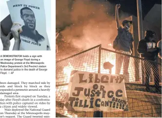  ??  ?? A DEMONSTRAT­OR holds a sign with an image of George Floyd during a Wednesday protest at the Minneapoli­s Police Department’s 3rd Precinct station to demand justice in the death of George Floyd. | AP
A PROTESTER cheers as fire burns outside a Minneapoli­s police precinct during protests over the arrest of George Floyd, who later died in police custody, in Minneapoli­s. | EPA-EFE