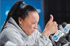  ?? SEAN D. ELLIOT/THE DAY ?? South Carolina head coach Dawn Staley describes her interactio­n with a UConn fan to the media on Sunday at the Times Union Center in Albany, N.Y.