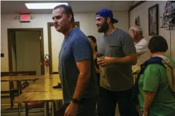  ?? Staff photo by Hunt Mercier ?? ■ St. Louis Blues’ Pat Maroon, center, smiles as he enters the VIP Lounge on Monday at Four States Fairground­s in Texarkana, Ark. The Stanley Cup winner played for the Texarkana Bandits when he was a teenager.