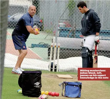  ??  ?? Hitting masterclas­s: Julian Wood, left, passes on his expert knowledge in the nets