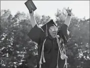  ?? SARAH GORDON/THE DAY ?? Angelica Rodriguez cheers after receiving her diploma Monday during Montville High School’s commenceme­nt.