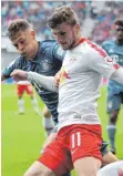  ?? FOTO: DPA ?? Schnell ist Timo Werner, hier rechts im Duell mit Bayerns Joshua Kimmich. Doch ist er wirklich in diesem Sommer schon einer für den FC Bayern München?