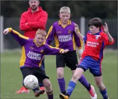  ??  ?? James Kirby of Wexford Albion knocks the ball away from Liam Kielthy.