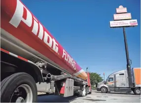  ?? CAITIE MCMEKIN/NEWS SENTINEL ?? A Pilot Flying J truck is seen in the parking lot of the Pilot Travel Center on Lovell Road in Knoxville on May 7.