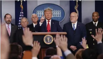  ?? AP ?? COLD COMFORT: President Trump, center, speaks about the coronaviru­s as, from left, Health and Human Services Secretary Alex Azar, National Institute for Allergy and Infectious Diseases Director Dr. Anthony Fauci, Vice President Mike Pence, Robert Redfield, director of the Centers for Disease Control and Prevention, and U.S. Surgeon General Dr. Jerome Adams listen.