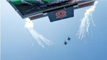  ?? AP PHOTO/GERALD HERBERT ?? Two F-16 jets fly over the 2015 football game between Alabama and Auburn in Auburn, Ala.