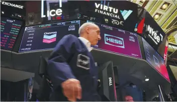  ?? Reuters ?? Traders work on the floor of the NYSE in New York. —