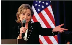  ?? AP/ROGELIO V. SOLIS ?? Sen. Cindy Hyde-Smith acknowledg­es family members Tuesday night during her victory celebratio­n at a hotel in Jackson, Miss. Democratic challenger Mike Espy gets a hug from his wife, Portia, at his watch party at the Mississipp­i Civil Rights Museum in Jackson.