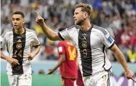  ?? LUCA BRUNO/AP ?? Germany’s Niclas Fuellkrug celebrates after he scored during their 1-1 tie with Spain in the World Cup’s group E match at the Al Bayt Stadium in Al Khor, Qatar, Sunday. Germany will have to beat Costa Rica and get help from Spain and Japan to advance.