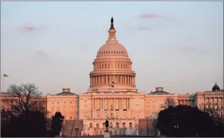  ?? Alex Brandon / Associated Press ?? The sun sets on the U.S. Capitol building on Thursday in Washington, D.C.
