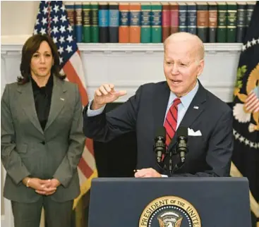  ?? JIM WATSON/GETTY-AFP ?? President Joe Biden, with Vice President Kamala Harris, announces his new border policy Thursday.