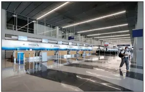  ?? (AP/Nam Y. Huh) ?? An American Airlines ticket counter sits nearly empty June 16 at O’Hare Internatio­nal Airport in Chicago. The Treasury Department said Thursday that it had finalized terms for new loans to American and four other airlines.