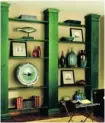  ?? Torstar Syndicate ?? Wood columns stained in hunter green add a classic feature to these book shelves.