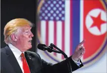  ?? Susan Walsh The Associated Press ?? President Donald Trump answers questions Tuesday about his summit with North Korean leader Kim Jong Un during a news conference on Sentosa Island, Singapore.