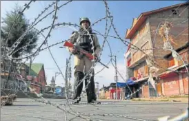  ?? AP ?? A paramilita­ry soldier stands guard at a temporary check point during restrictio­ns in Srinagar on Tuesday. Vehicles stayed off the road and shops closed in response to a shutdown called by the Hurriyat Conference, a day after seven Kashmiri separatist­s...