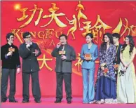  ??  ?? Jackie Chan (second from left) reunites with Hong Kong director Stanley Tong (third from left) in the action comedy KungFuYoga.