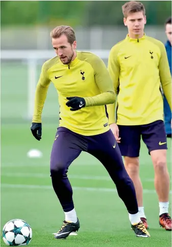  ?? — AFP ?? Tottenham Hotspur striker Harry Kane (left) at a training session in London on Tuesday, eve of their UEFA Champions League match against Real Madrid.