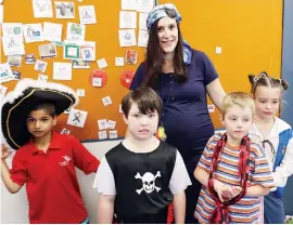  ??  ?? Joshua Passalacqu­a, Layla Kirkham, Zachary Downie and Haven McGillivra­y got into the spirit of the pirate theme with their class teacher Julie Rechsteine­r.