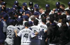  ?? AP PHOTO/DAVID ZALUBOWSKI ?? Players from the Colorado Rockies and San Diego Padres scuffle after Colorado’s Nolan Arenado was hit by a pitch from Padres starting pitcher Luis Perdomo in the third inning of a baseball game Wednesday in Denver.