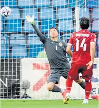  ?? ?? Armenia keeper David Yurchenko can’t keep out Oleksandr Zubkov’s effort for Ukraine’s second