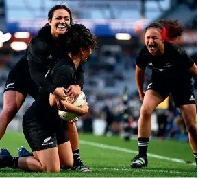  ?? GETTY IMAGES ?? Stacey Fluhler and Ruby Tui celebrate with Portia Woodman after she dotted down for one of her seven tries during the Black Ferns’ 95-12 win over Japan at Eden Park yesterday.