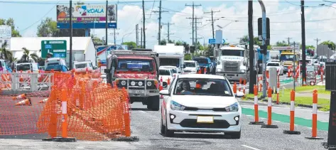  ?? ?? Vehicles negotiate traffic bollards and bunting erected to redirect traffic around the road works on Sheridan St.