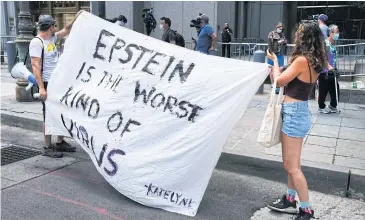  ?? AFP ?? People protest against Jeffrey Epstein outside the Manhattan courthouse where Ms Maxwell’s hearing was held.