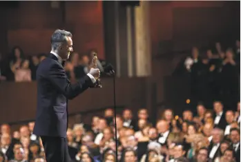  ?? Matt Sayles / Invision 2013 ?? Daniel Day-Lewis accepts the 2013 Academy Award for best actor for his role in “Lincoln” at the Dolby Theatre in Los Angeles. Day-Lewis is the only person to have won the award three times.