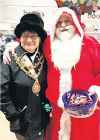  ??  ?? ●● Rossendale Mayor Ann Kenyon with Father Christmas