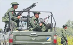  ??  ?? ARMED GUARD: Myanmar army troops patrol Maungdaw town in Rakhine State near the Bangladesh border.