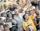  ?? ?? INTERVIEWI­NG Chiefs and Pirates fans in 2010.