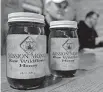  ??  ?? Jars of honey feature labels with St. Gregory's Abbey's new Mission Monks branding.
