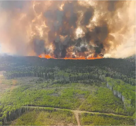  ?? GOVERNMENT OF ALBERTA FIRE SERVICE / THE CANADIAN PRESS FILES ?? As snow melts and springlike conditions return to Western Canada, oil and gas producers are prepared for what could be another fiery year.