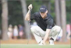  ?? David Goldman / Associated Press ?? Chris Thompson lines up a putt during the second round of the U.S. Open in Pinehurst, N.C., on June 13, 2014.