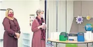  ?? [PHOTO PROVIDED] ?? Educator Rachel Thomas, at right, and her students were the surprise recipients of a newly remodeled classroom at Mustang Creek Elementary School. At left is principal Leah Anderson.