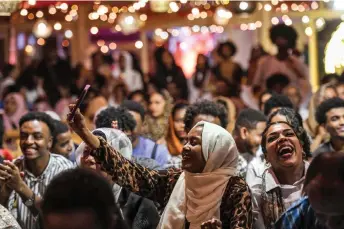  ?? ?? Sudanese people living in Egypt due to conflict in their country, attend a Sudanese cultural event during the Muslim holy fasting month of Ramadan, in Cairo.