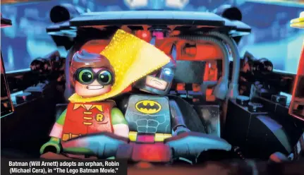  ??  ?? Batman (Will Arnett) adopts an orphan, Robin (Michael Cera), in “The Lego Batman Movie.”