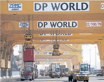  ?? REUTERS ?? Terminal tractors line up to load containers into a cargo ship at DP World’s fully automated Terminal 2 at Jebel Ali Port in Dubai in this file photo.