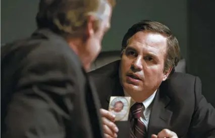  ?? Mary Cybulski / Focus Features ?? In “Dark Waters,” Mark Ruffalo, right, plays attorney Rob Bilott. “It’s a horror story that has to be told,” the actor says.