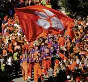  ?? GETTY IMAGES ?? Much like Auburn, Clemson has passionate fans and longstandi­ng traditions. Sometimes called “Auburn with a lake,” it’s an ACC schoolwith an SEC aura.