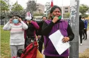  ?? Martin Mejia / Associated Press ?? Distraught relatives wait Sunday outside a police station for news of their loved ones after a stampede at a disco in Lima, Peru.