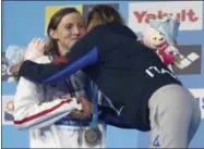  ?? DARKO BANDIC — THE ASSOCIATED PRESS ?? Italy’s gold medal winner Federica Pellegrini is congratula­ted by United States’ silver medal winner Katie Ledecky, left, after the women’s 200-meter freestyle final during the swimming competitio­ns of the World Aquatics Championsh­ips in Budapest,...