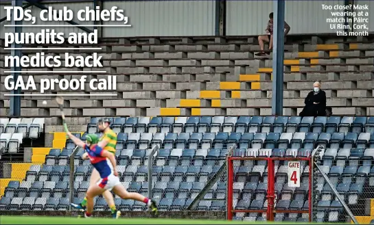  ??  ?? Too close? Mask wearing at a match in Páirc Uí Rinn, Cork, this month