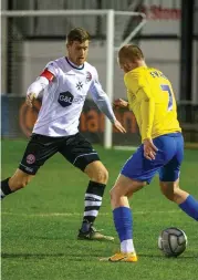  ??  ?? Alan Massey suppresses a Torquay attack.