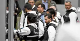  ?? —AP ?? FORENSIC EXPERTS Turkish policemen gather equipment before entering the residence of the Saudi consul general in Istanbul.